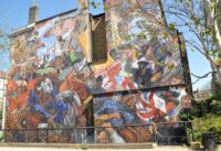 Nástěnná malba připomínající úspěšnou blokádu pochodu britské fašistické strany, kterou uspořádali obyvatelé této čtvrti na Cable Street v roce 1936.